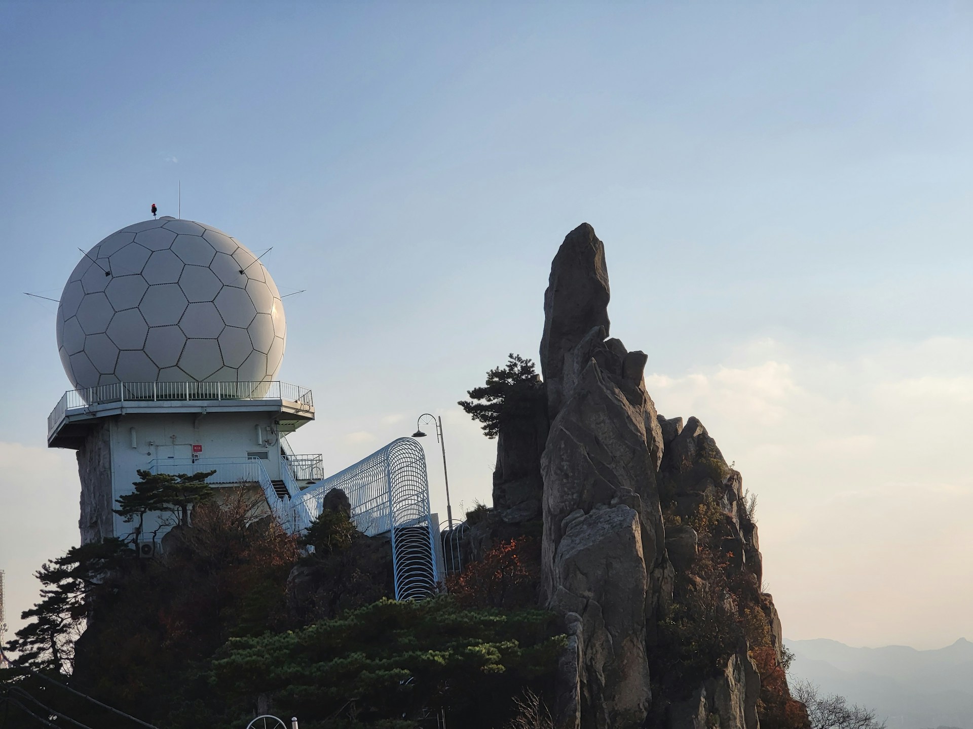 woman wearing yellow long-sleeved dress under white clouds and blue sky during daytime