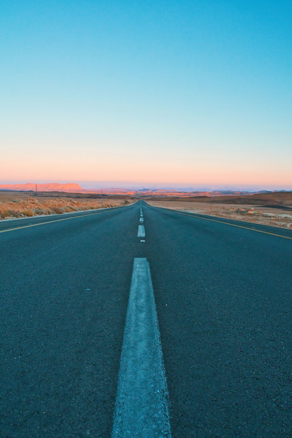 a road with a blue sky