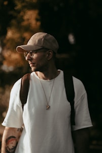 a man wearing a hat and glasses