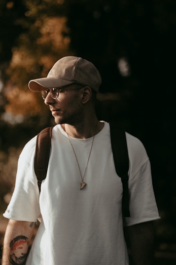 a man wearing a hat and glasses