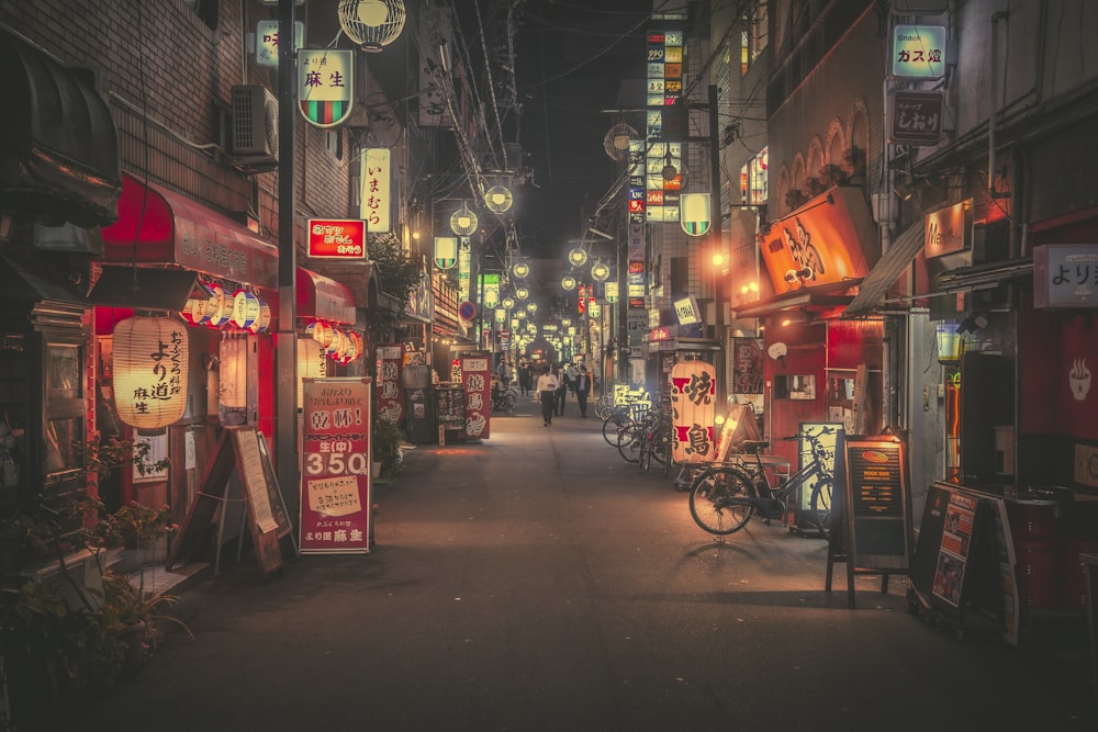 a street with many signs and people