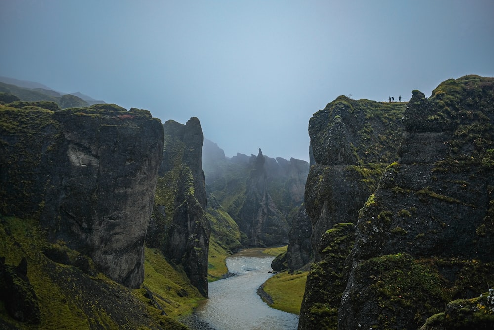 a river between rocky mountains