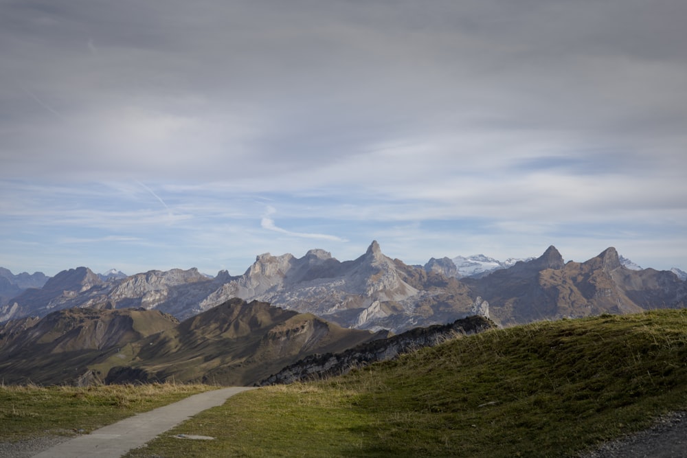 a road leading to a mountain range