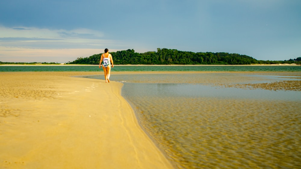 a man walking on a beach