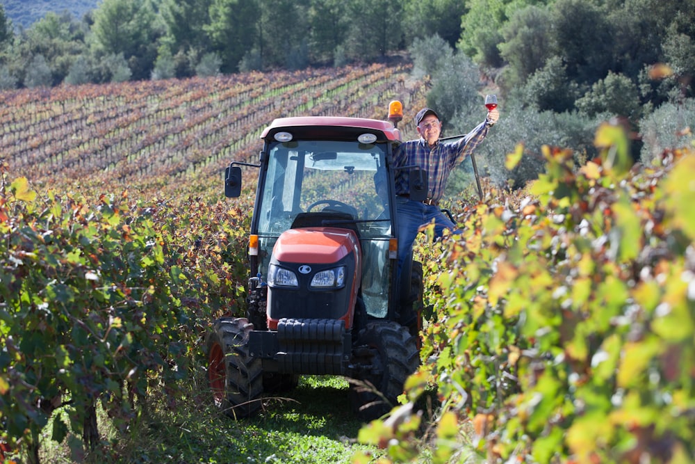 a person driving a tractor