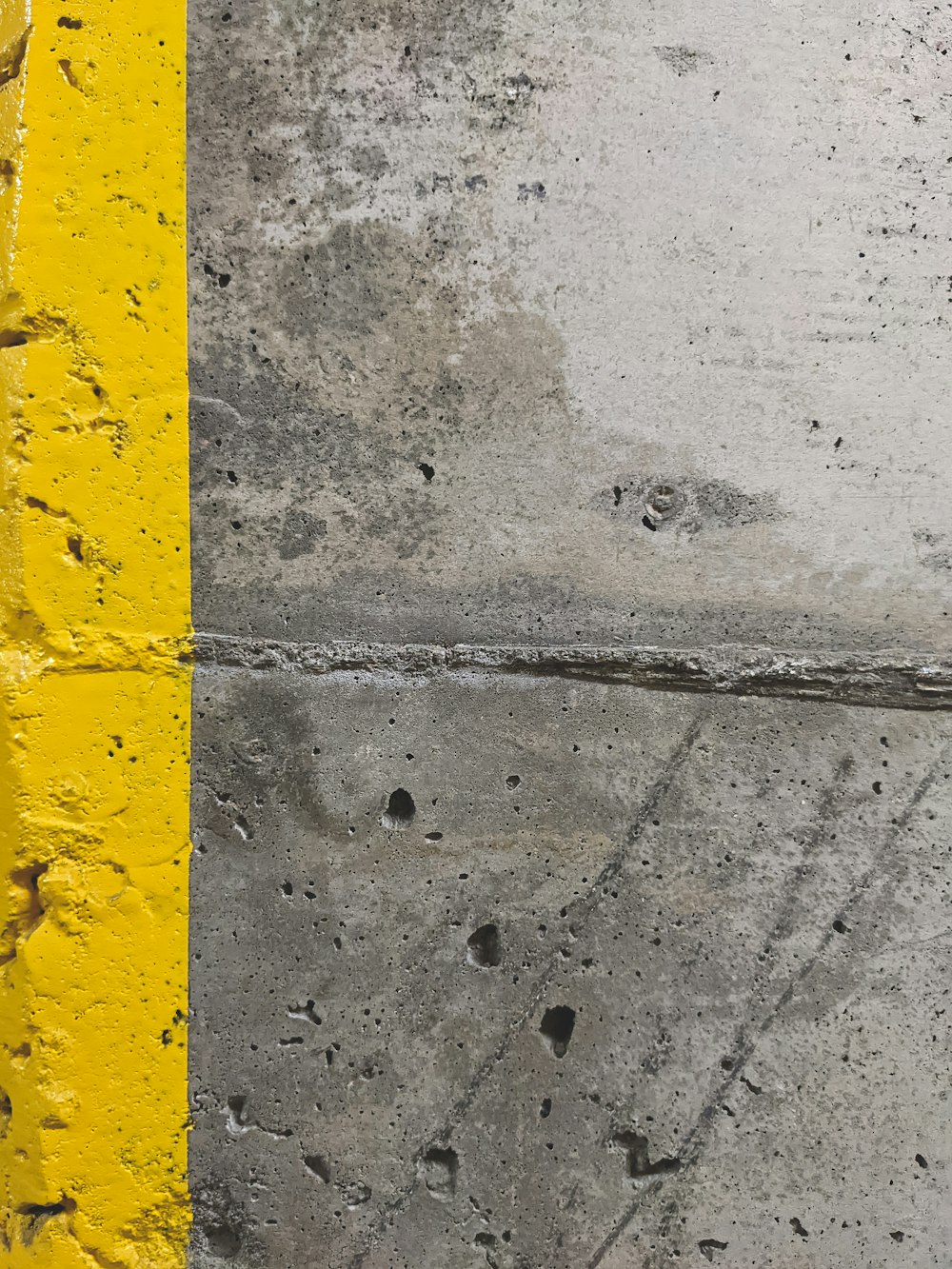 a wet road with a yellow line