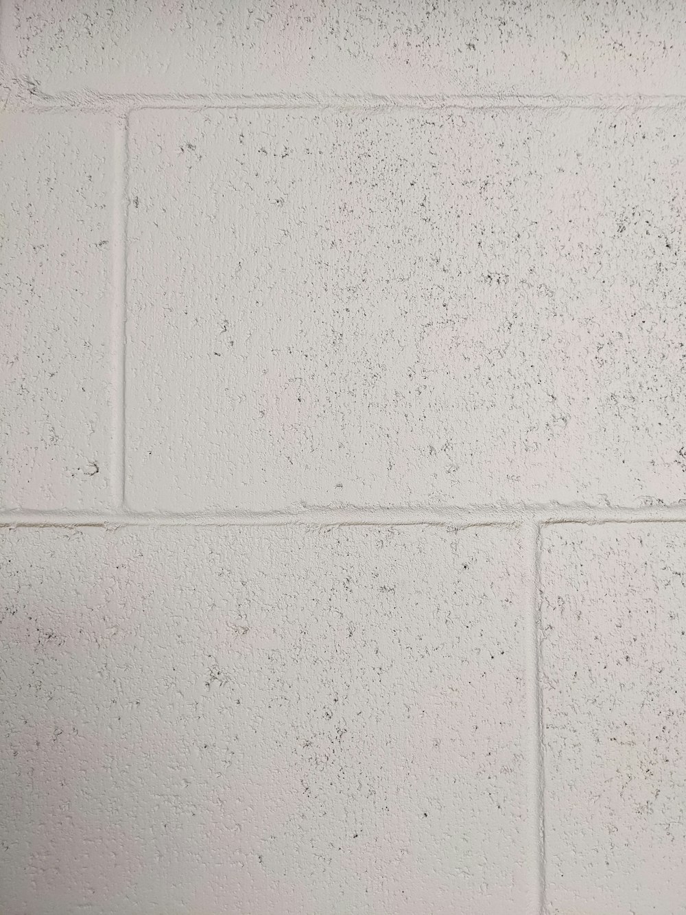 a white wall with a white line