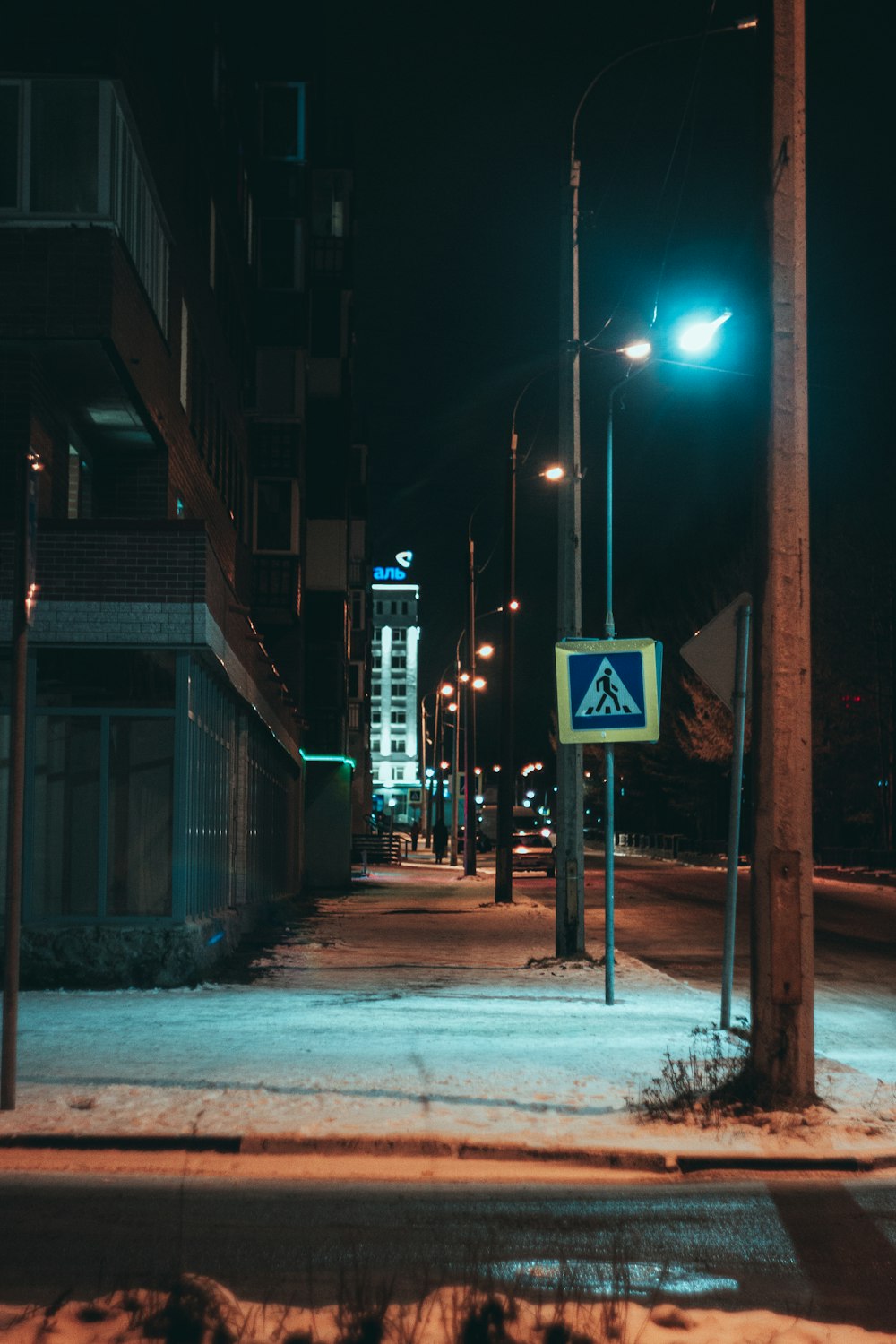 a street sign on a snowy street