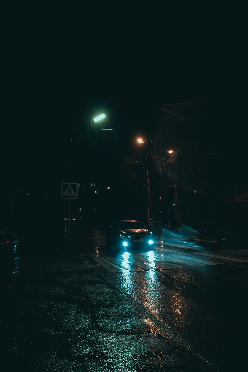 a street at night with cars on it