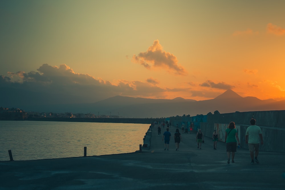 people walking on a beach