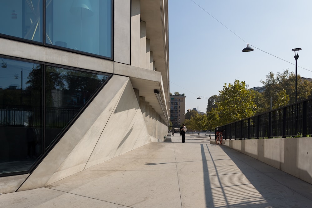 a person walking on a sidewalk