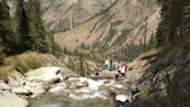 Group of hikers enjoying fresh mineral water breaks amid scenic Stuttgart landscapes.