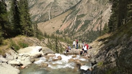 Group of hikers enjoying fresh mineral water breaks amid scenic Stuttgart landscapes.
