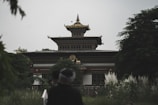 A traditional temple surrounded by lush greenery.