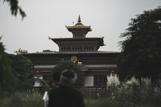 people walking towards a building