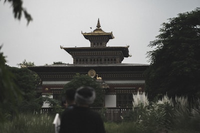 A traditional temple surrounded by lush greenery.