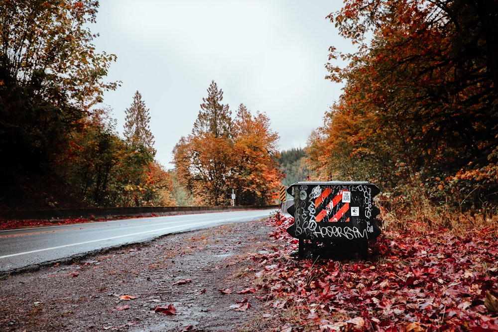 a trash can on the side of a road