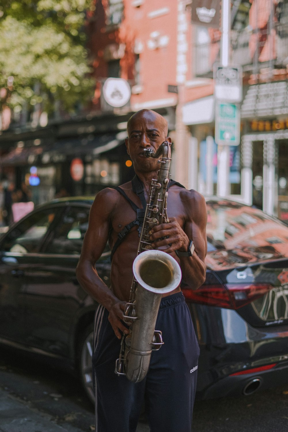 a person in a garment holding a guitar