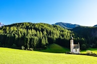 A choir singing in a picturesque outdoor location.