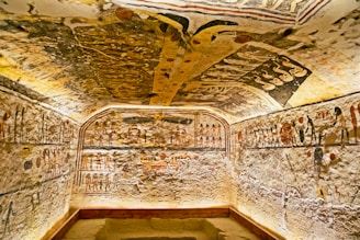 Archaeologists carefully excavating a burial chamber in the Asasif necropolis.