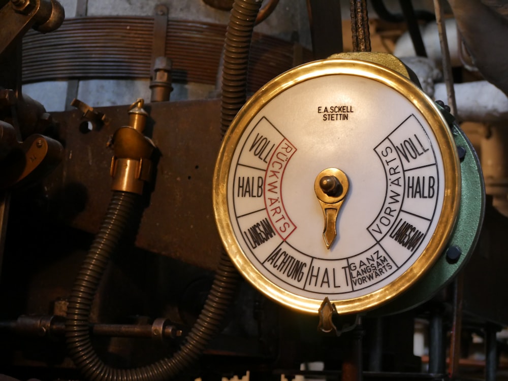 a clock on a wooden shelf