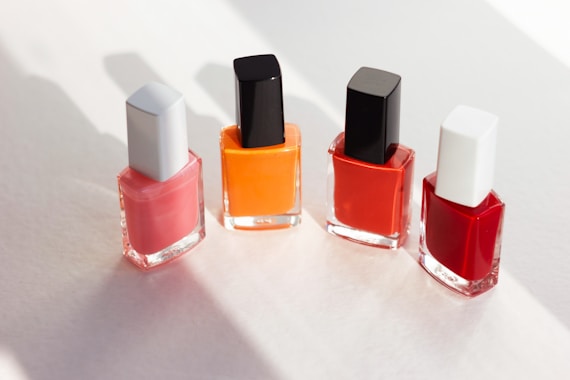 a group of different colored lipsticks