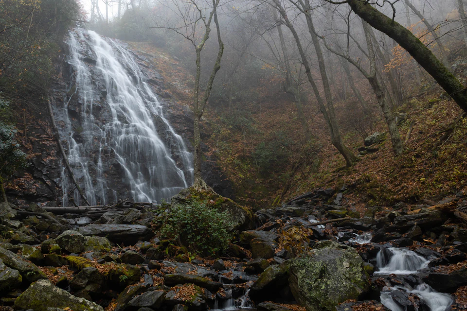 Waterfall in a misty forest
