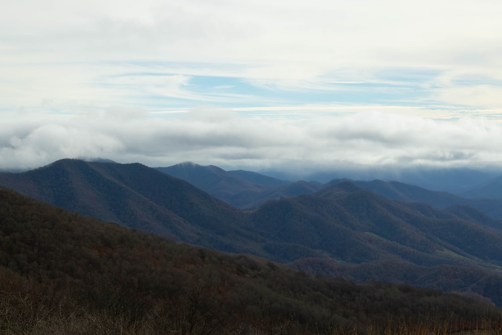 a landscape with hills and clouds