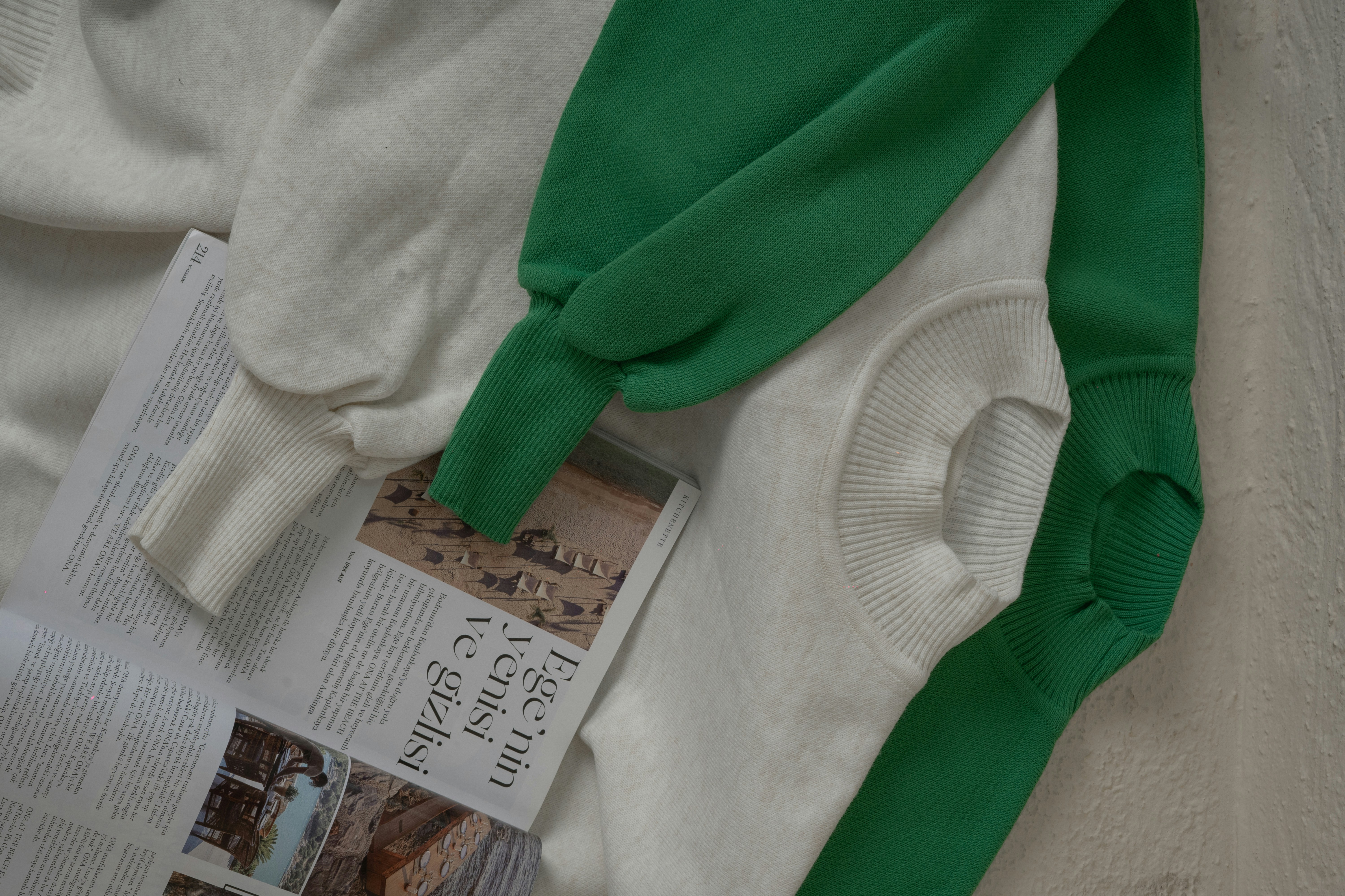 a green bow tie on a white surface