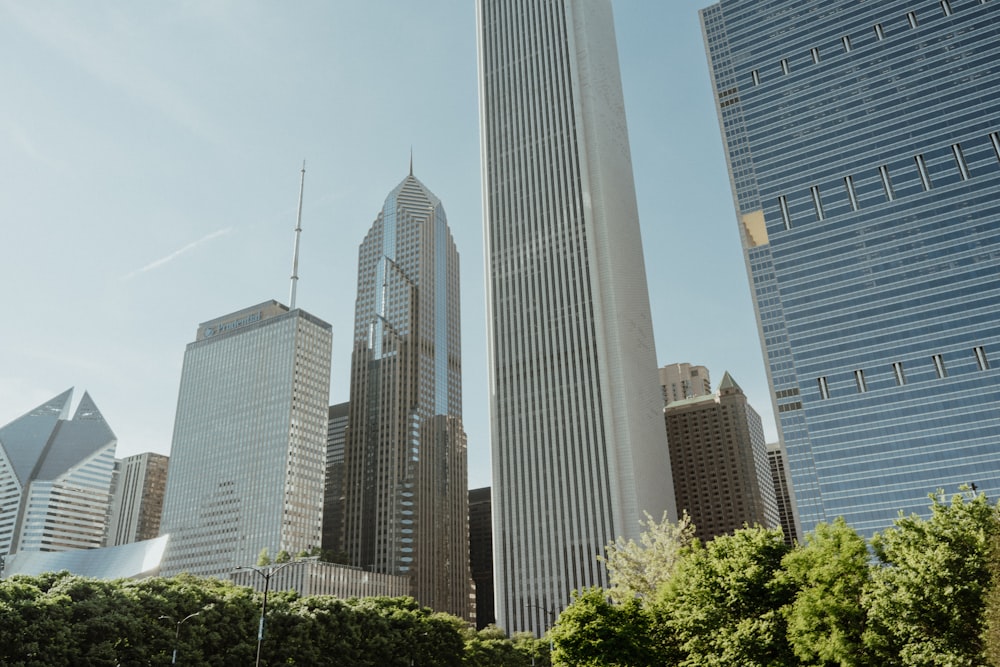 a group of tall buildings with Aon Center in the background