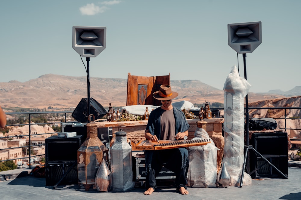 a person sitting at a table outside