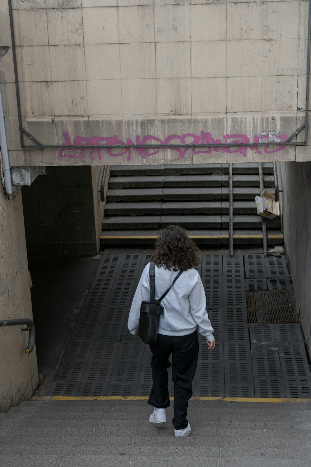 a man walking down a sidewalk