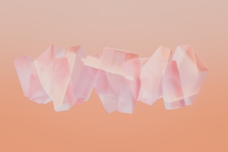 Soft pastel pink abstract shapes swirling gently on a light background.