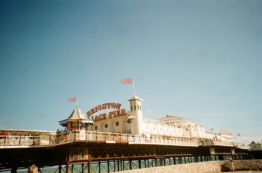 a large white building with a bridge