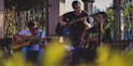 a group of men playing guitars