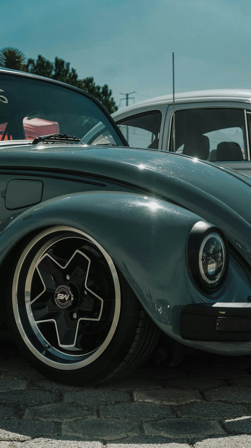 a black car with a large rim