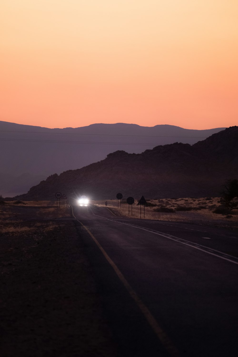 a road with a sunset