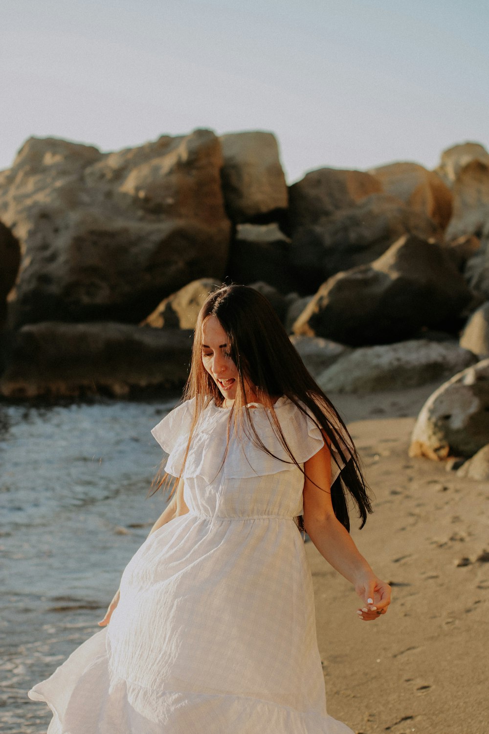 a person in a wedding dress on a beach