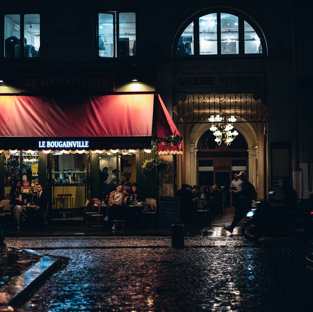 a group of people sitting outside a building