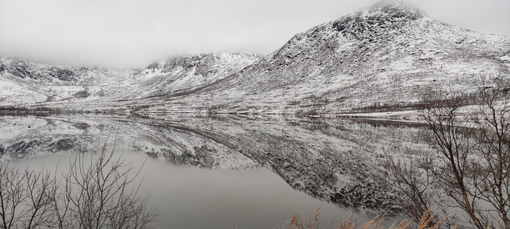 a river with snow on the banks