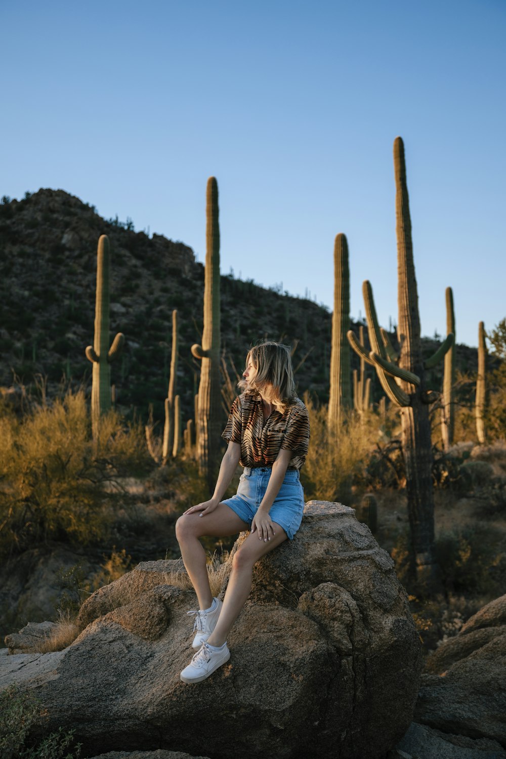 a person sitting on a rock