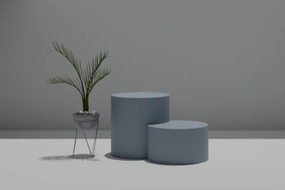 An industrial metal plant stand holding several potted plants, set against a minimalist background.