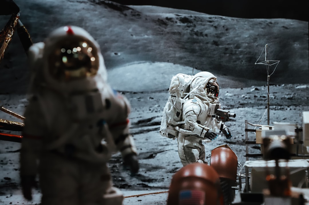 a few people in space suits,