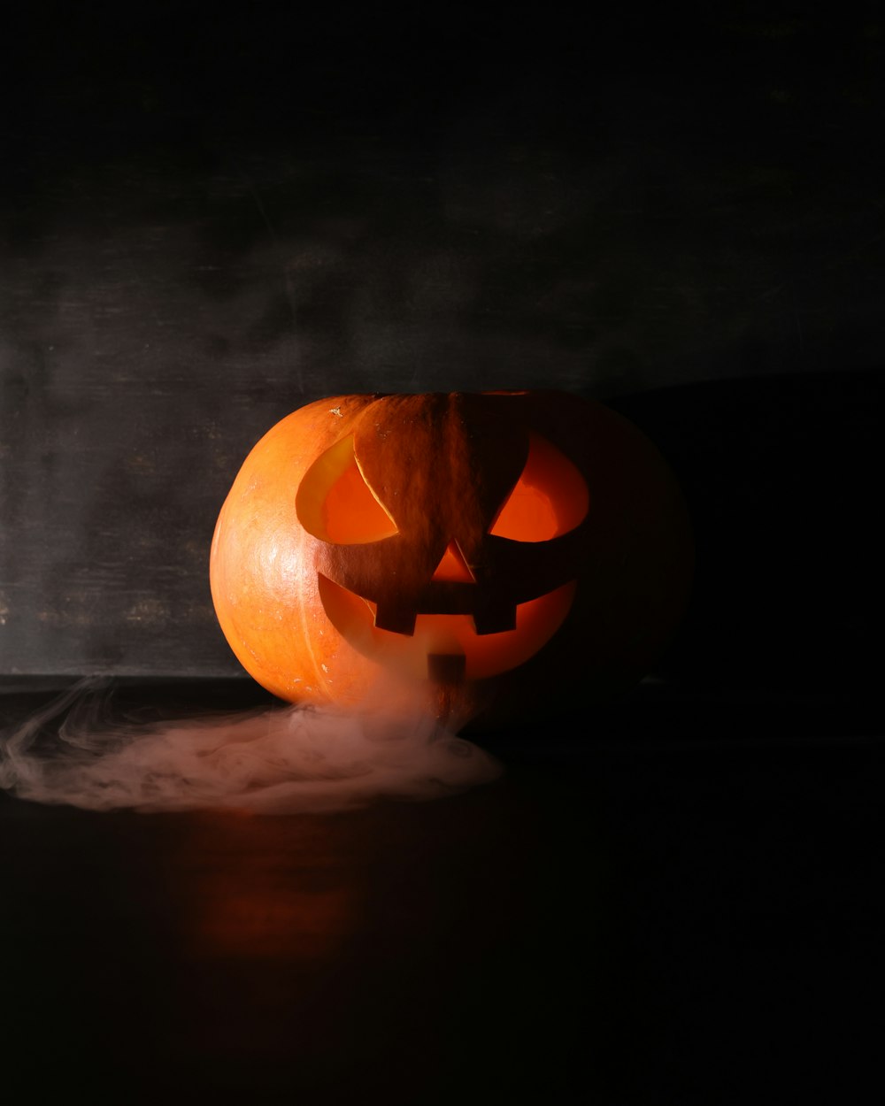 a carved pumpkin with a light inside