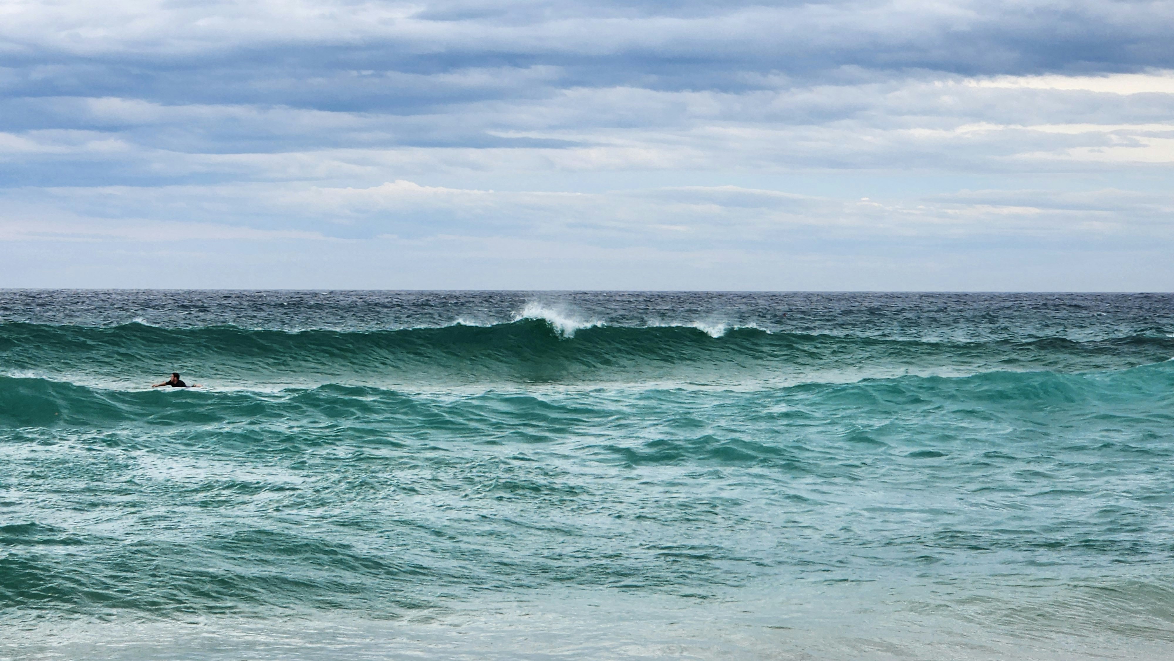 a person surfing in the sea