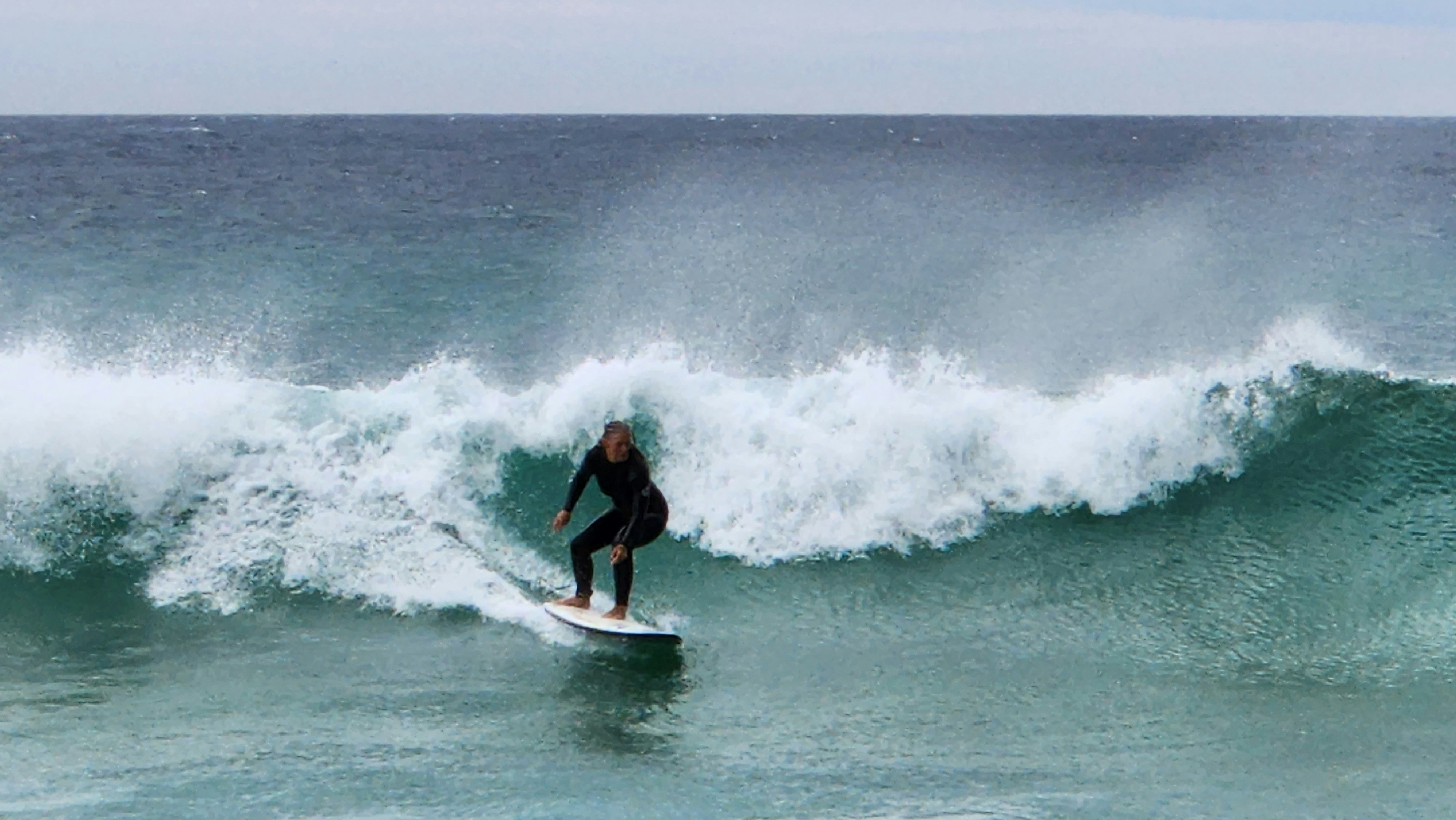 a man surfing on a wave
