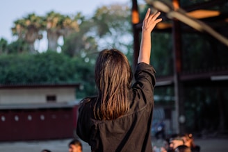 a person with the hand raised