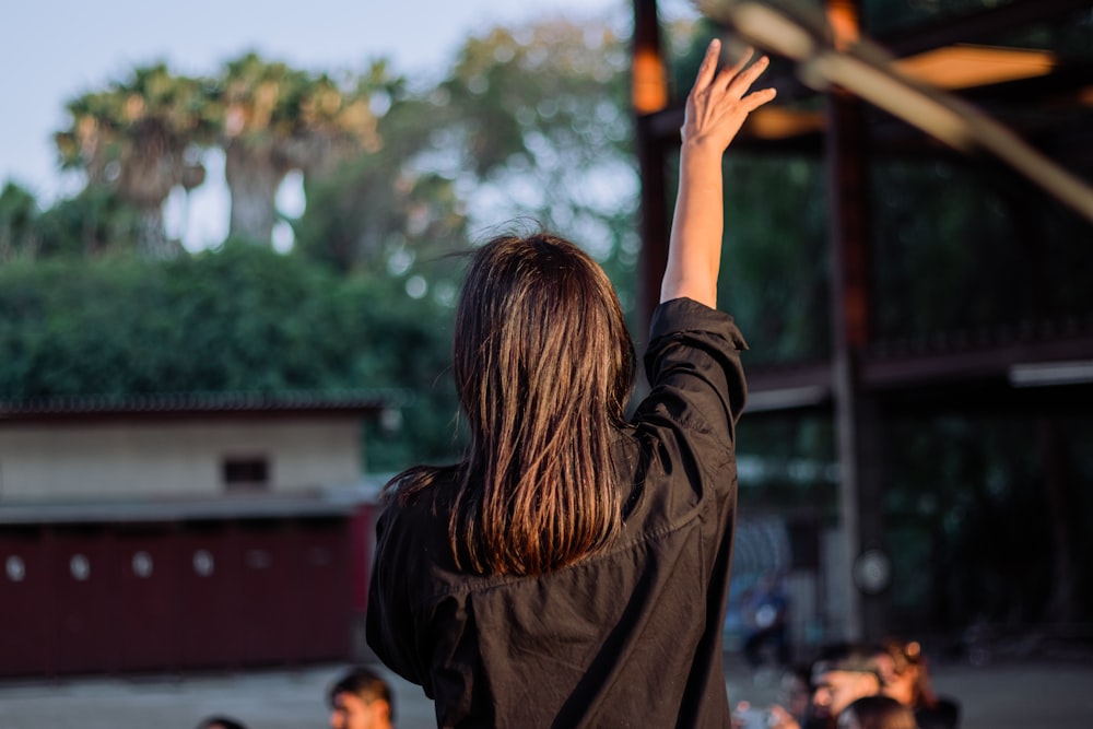 a person with the hand raised