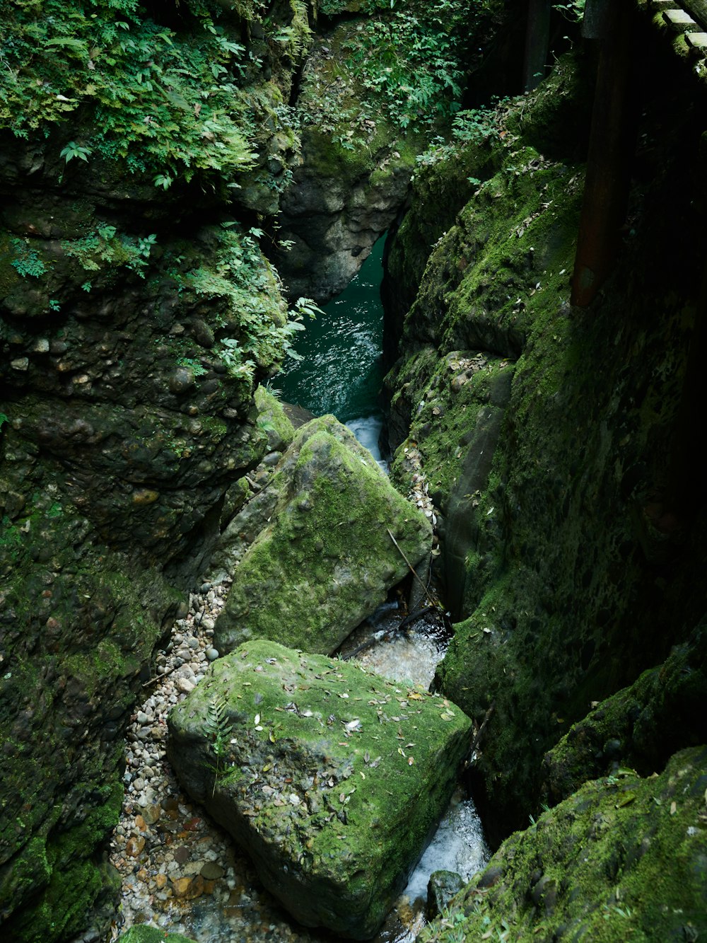 a stream of water flowing through rocks