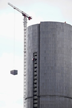A crane lifting materials at a building site.